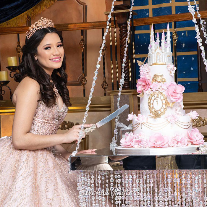 young woman cutting princess themed cake