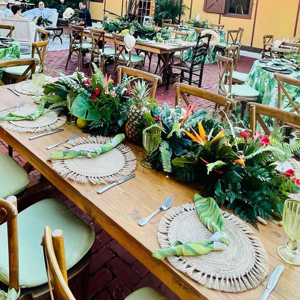 outdoor table display with tropical flowers