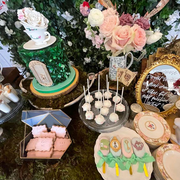 alice in wonderland themed decor with sweets